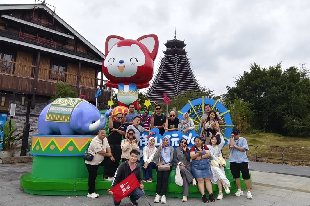 Team photo with a festival display, 2025 Company Trip